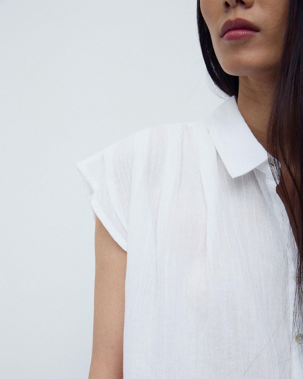CAMISA SIN MANGAS PLIEGUES
