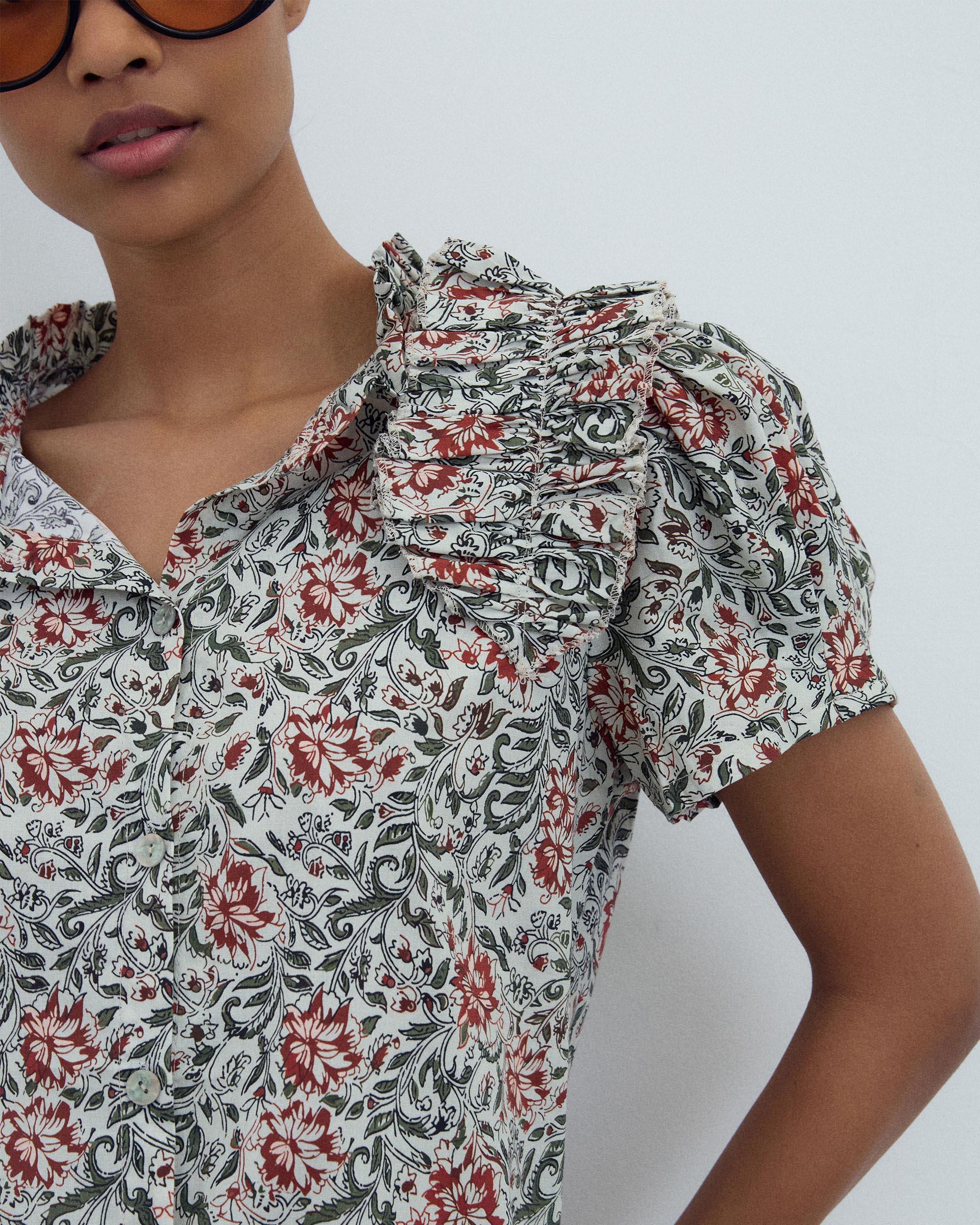 BLUSA MANGA ABULLONADA VOLANTE ESTAMPADA