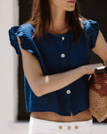 BLUSA SIN MANGAS VOLANTES BOTONES