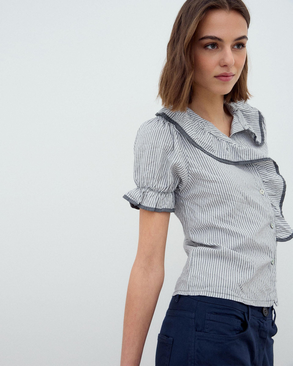 CAMISA VOLANTE LATERAL RIBETE